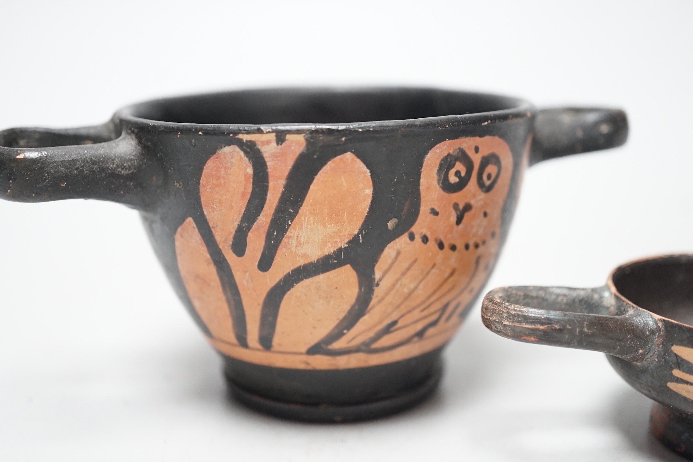 A 4th century B.C. South Italian Greek red figure bowl skyphos, together with another similar smaller vessel. Larger 14.5cm handle to handle